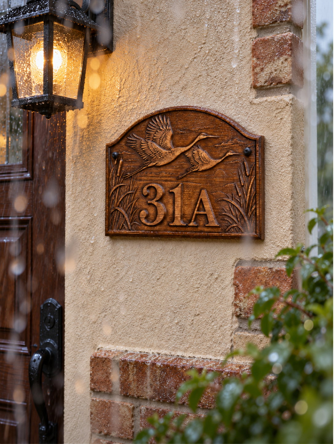 Relief shaped by light — Wooden house number with cranes – facade plaque